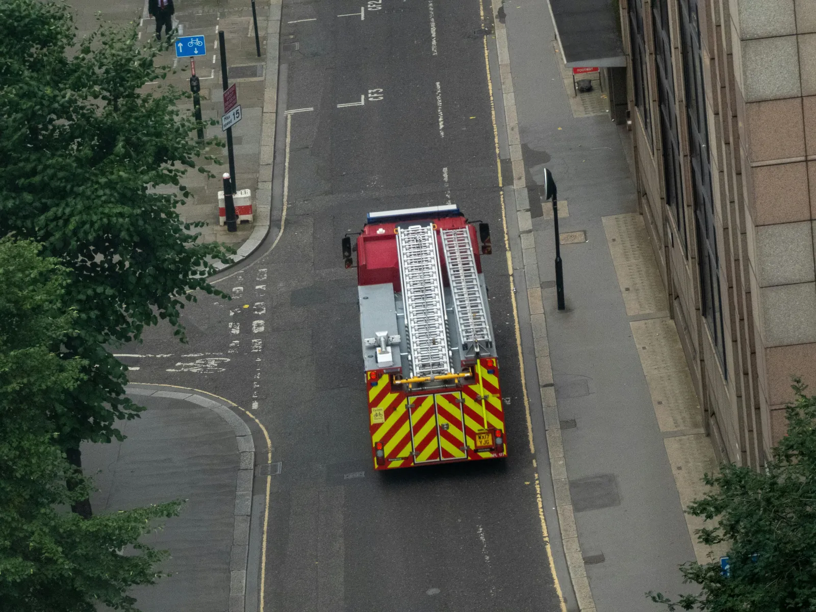 A fire engine on a city street, seen from above