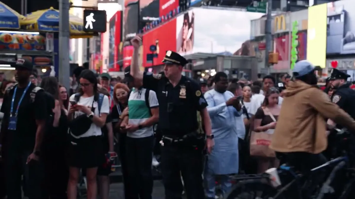 A crowd filling Times Square during a live takeover